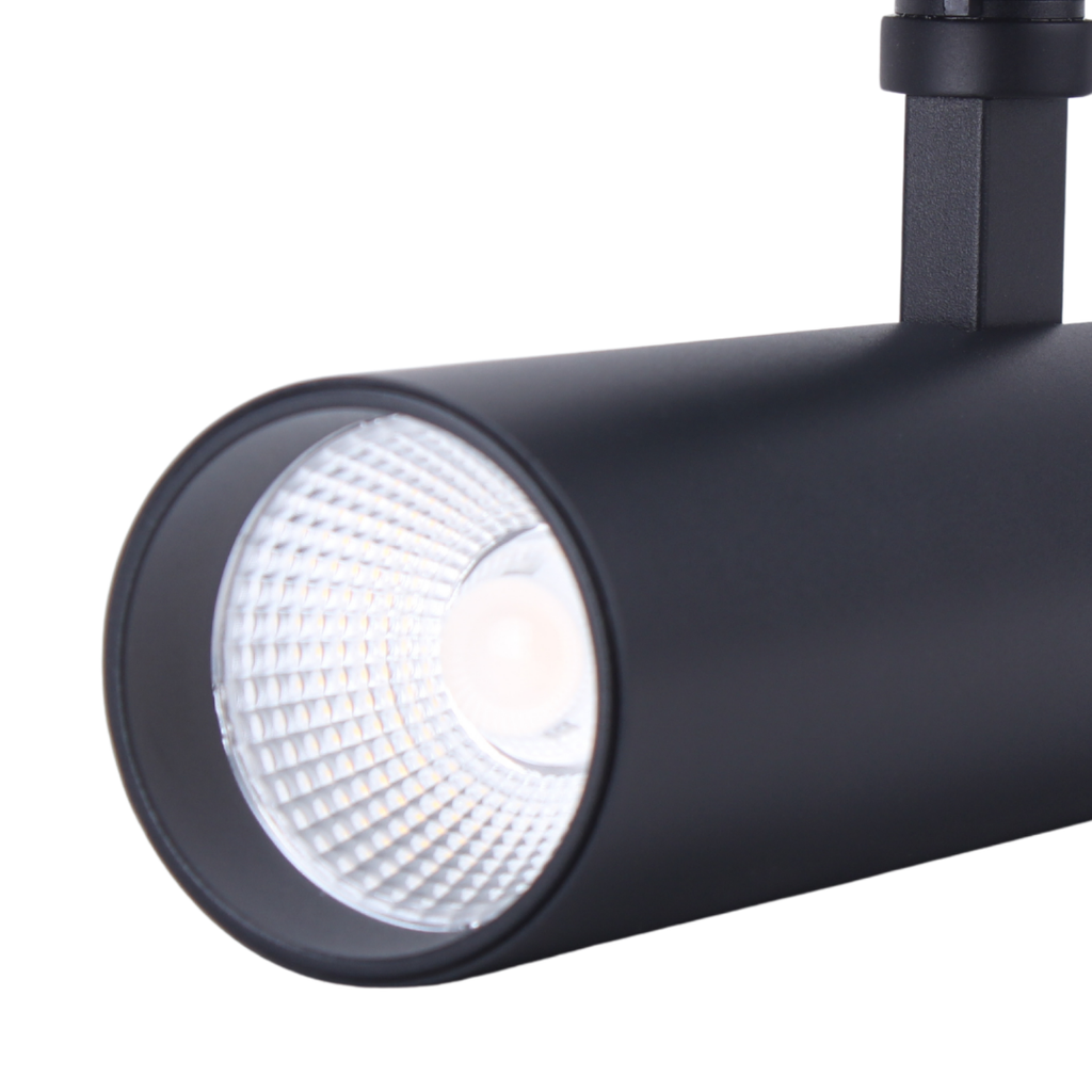 Zwarte spotkop met geïntegreerde LED-lens, gericht op het oppervlak