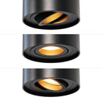 Zwarte GU10-spot met reflectoropening en warm licht, cilinderarmatuur op rail