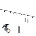 Zwarte railverlichting met 6 GU10 spots en 2 hangende cilindervormige lampjes.