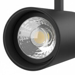 Zwarte railspot met LED-lens en reflector, zichtbare lichtopening