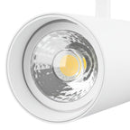 LED-railspot met ronde reflector en zichtbare COB-led in wit armatuur.