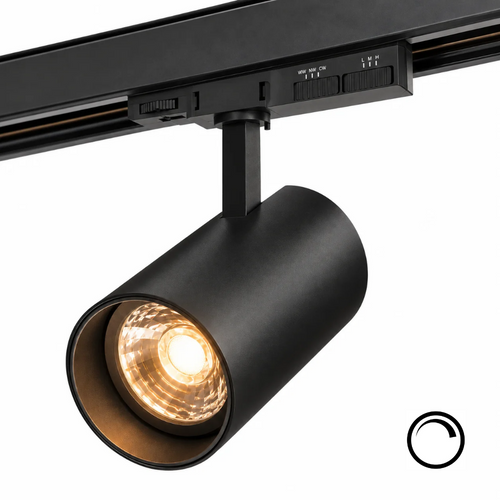 Zwarte railspot met warme amber LED-gloed in de cilindrische spotkop.