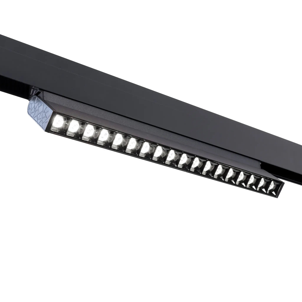 Zwarte lineaire LED-railverlichting met reeks dots, smalle lens en warm licht